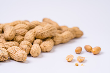 Peanuts with shells on white background