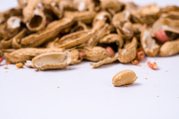 Peanuts with shells on white background
