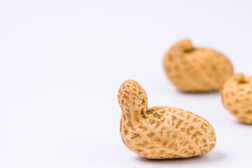 Peanuts with shells on white background