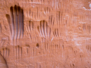 American Indian Handprints on Red Rock wall in desert