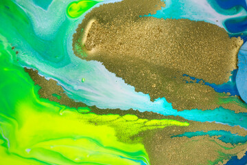 Neon colored marble pattern with golden glitter. Fluorescent liquid background. Artwork abstract bright texture.