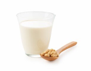 Soy milk, soybeans and a wooden spoon on a white background