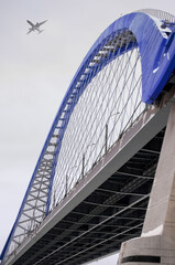 blue bridge and plane