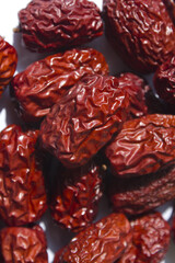 close up Red dates on white background.