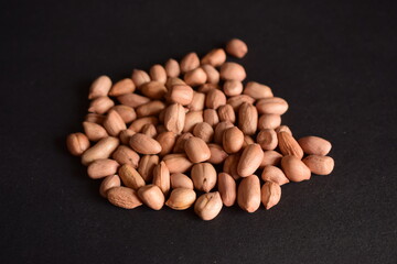 Top View of Closeup Peanuts-Groundnut On isolated Black Background