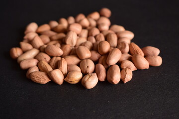 Top View of Closeup Peanuts-Groundnut On isolated Black Background