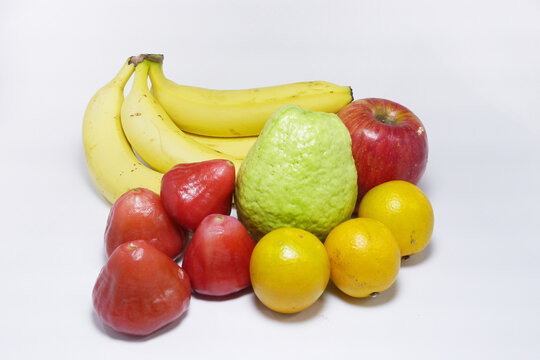 Tropical fruits isolated background. Banana, apple, guava, oranges and wax apples on white background. Concept for harvest, eating, vitamins and health.