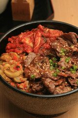 fried pork with spicy korean sauce (bulgogi) on top rice - korean food style