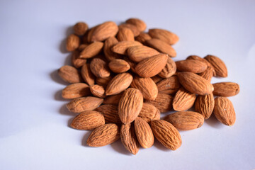 Top View of Closeup Organic Almond Nuts in Group On isolated White Background
