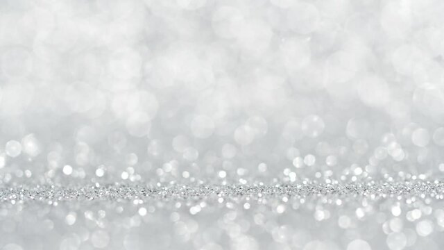 Abstract background, shining, sparkling lights of silver color glitter texture