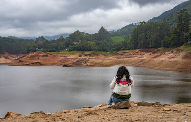 Fototapeta premium girl thinking and feeling the true nature at lakeside
