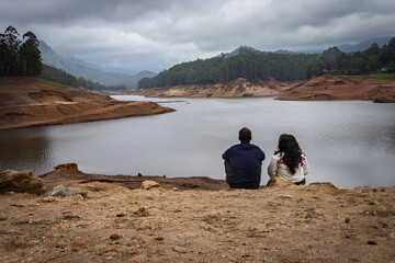 couple thinking and feeling the true nature at lakeside