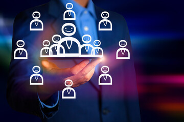 person holding a laptop with symbol and network on the business world