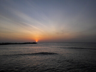 Naklejka na ściany i meble sunrise at the dawn from sea horizon