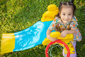 Close up and selective focus with blurred background for top-view shot of adorable asian preschool...