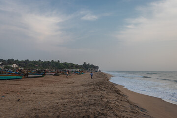 Sunrise on sea beach with waves