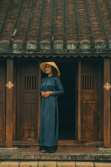 Beautiful Vietnam girl from Hue city, Vietnam who wearing Ao dai. Ao dai is famous traditional custume for woman in Vietnam. Vintage style,travel and relaxing concept.