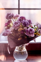 a rare variety of tulip. bouquet of double purple tulips. bouquet with Christmas lights