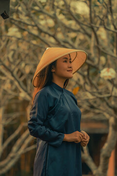 Beautiful Vietnam girl from Hue city, Vietnam who wearing Ao dai. Ao dai is famous traditional custume for woman in Vietnam. Vintage style,travel and relaxing concept.