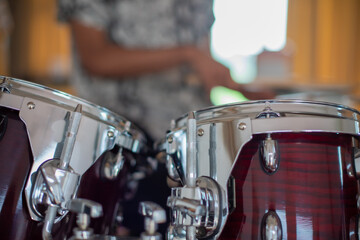 Close up shot of drums with drummer blurred in background