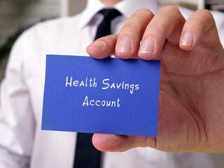 Business concept about Health Savings Account with inscription on the piece of paper.