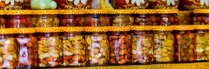 Canned nuts in jars. Autumn countryside fair healthy products