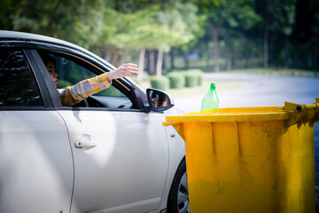 Woman hand picking up garbage plastic and Glass bottles for cleaning at park