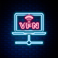 Glowing neon line VPN Computer network icon isolated on brick wall background. Laptop network. Internet connection. Colorful outline concept. Vector.