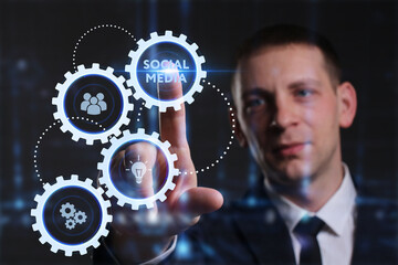 Business, Technology, Internet and network concept. Young businessman working on a virtual screen of the future and sees the inscription: Social media