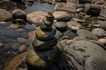 Pyramid Of pebbles or Stones On river edge