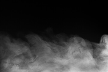 Blur white water vapour on isolated black background. Abstract of steam with copy space. Steam flow. Smoke on white background.
