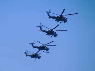 Russia, St. Petersburg - June 24, 2020: Russian military helicopters Mi-28 of the Russian Air Force in flight at the Victory Parade in World War II.