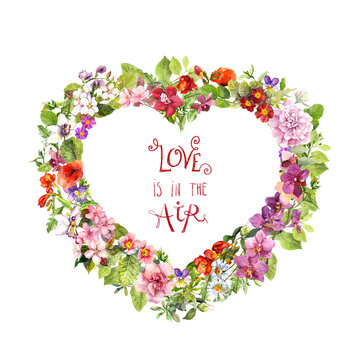 Floral heart shape, motivate quote Love is in the air . Summer flowers, meadow herbs, wild grass. Watercolor for Valentine day, wedding