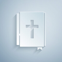 Fototapeta premium Paper cut Holy bible book icon isolated on grey background. Paper art style. Vector.