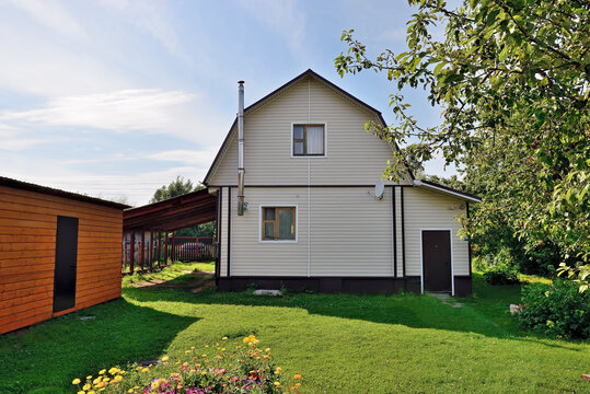 Typical Russian cottage, dacha in Russian. Dacha is a house for seasonal residence, located in the countryside. Designed for family recreation and the cultivation of fruits and vegetables