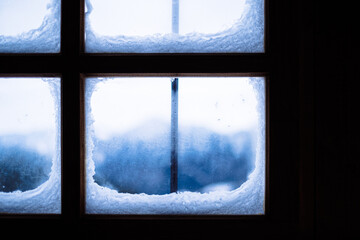 full frame shot of wooden window in snow