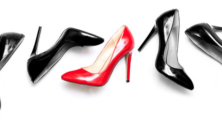 female shiny red and black stilettos on a white background