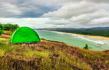 camping solo at mountain top with amazing view and dramatic sky