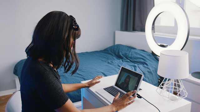 Young Woman Recording Online Lesson In Her Bedroom Illuminated Buy Ring Light. High Quality Photo