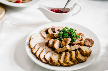 Meat slicing with delicious salami, pieces of sliced meat. Meat platter with selection. Cold smoked meat plate with bacon, pork chops. top view