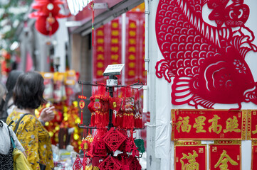 Outdoor Asia Spring Lunar Chinese New Year ornaments decorations. Red is seen as lucky and auspicious by many who believes in traditional customs. Translation:"Spring, Wealth Fortune Good Luck"