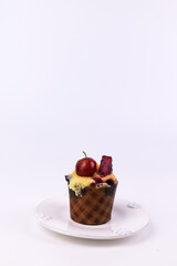 Close up Chocolate Muffin topped with Fresh fruit on White Background