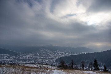 Rural landscape in winter Carpathian mountains