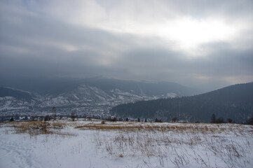 Fototapeta na wymiar Rural landscape in winter Carpathian mountains