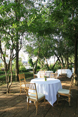 Table setting with chairs for garden banquet