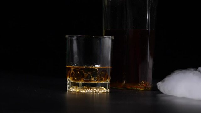  Whiskey glass on black background beautiful 