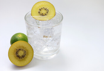 Fototapeta na wymiar Summer cocktail with kiwi, lime and ice. Kiwi soda in a glass.