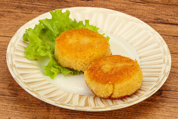 Vegan cuisine - Potato cutlet in the plate