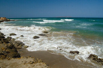 Fototapeta na wymiar wave on the sand beach, Crete
