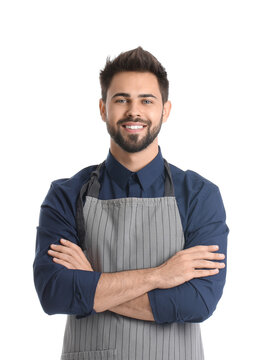 Young man wearing apron on white background